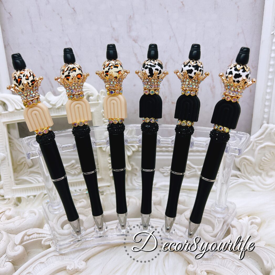 Elegant Beaded Ballpoint Pens,Elegant black ballpoint pens with gold-tone crowns and rhinestone accents, featuring silicone beads, rhinestone spacers, and refillable black ink.