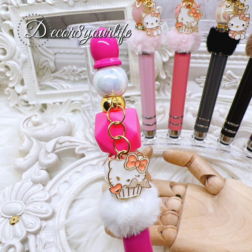 Hello Kitty Beaded Stylus Pens with faux fur poms in assorted colors, featuring licensed Sanrio Hello Kitty charms and colorful beads.