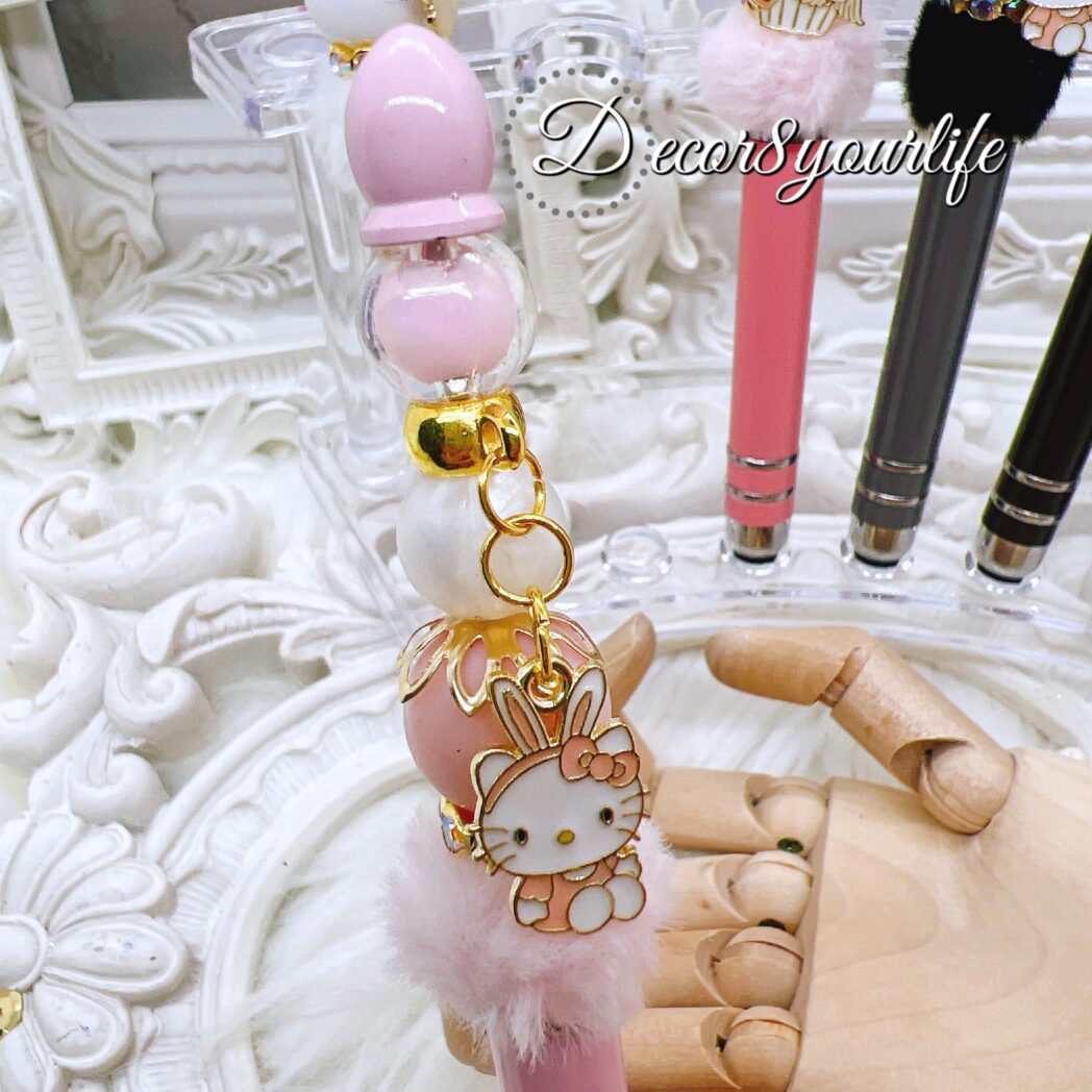 Hello Kitty Beaded Stylus Pens with faux fur poms in assorted colors, featuring licensed Sanrio Hello Kitty charms and colorful beads.