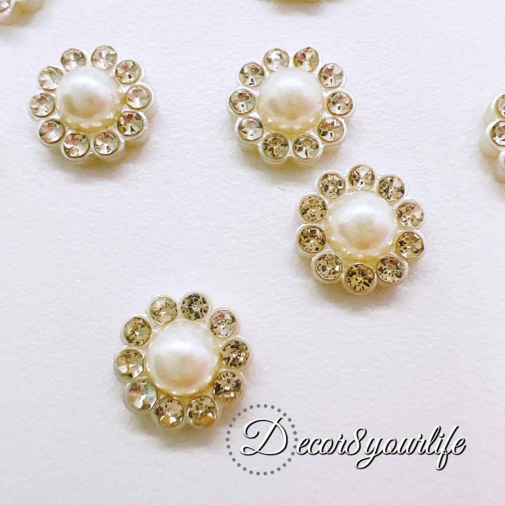 Elegant and versatile flat-back flower pearl buttons adorned with rhinestones. Perfect for wedding invitations, scrapbooking, or DIY crafts, these 3/8" embellishments bring a luxurious touch to any project.