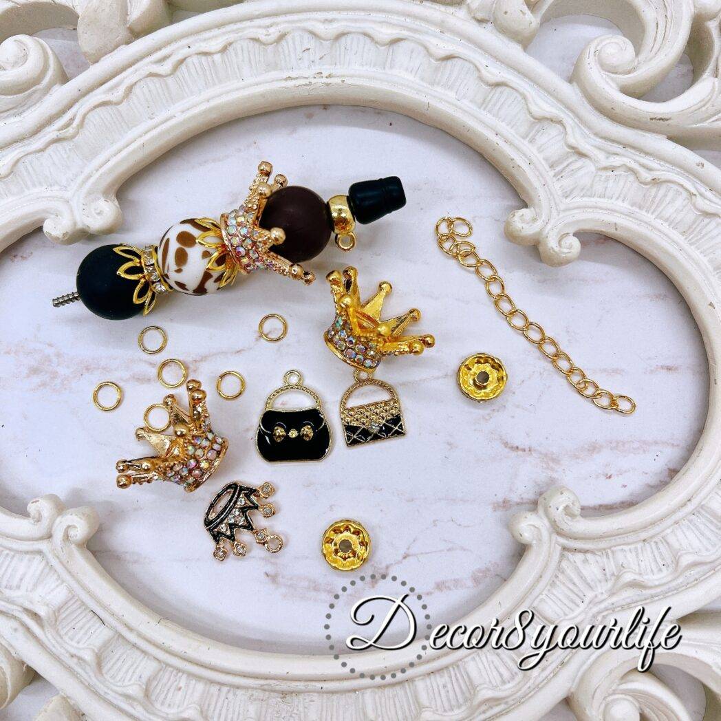 Leopard print bead and charm kit for beadable pens with crown charms, purse charms, and rhinestone accents.