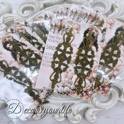 Pack of two elegant filigree metal embellishments, measuring 3.25 x 1.5 inches, perfect for DIY crafts, scrapbooks, and journals.