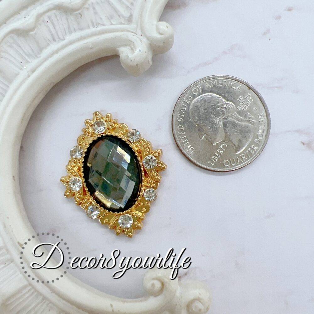 Flat-back rhinestone brooch with intricate design, ideal for crafting and embellishments