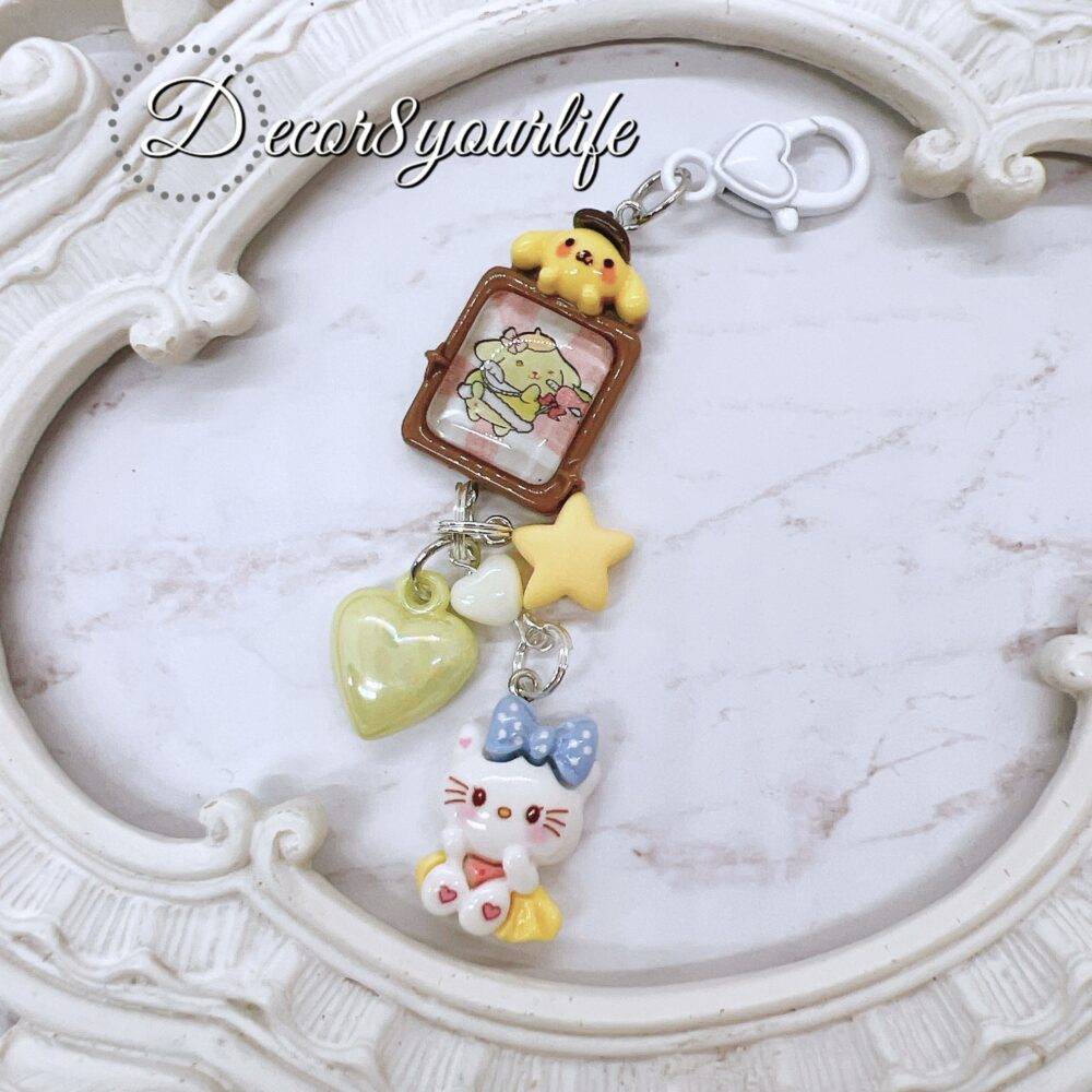 Handmade Hello Kitty key chain in pastel candy colors featuring Sanrio characters, perfect stocking stuffer or gift for friends