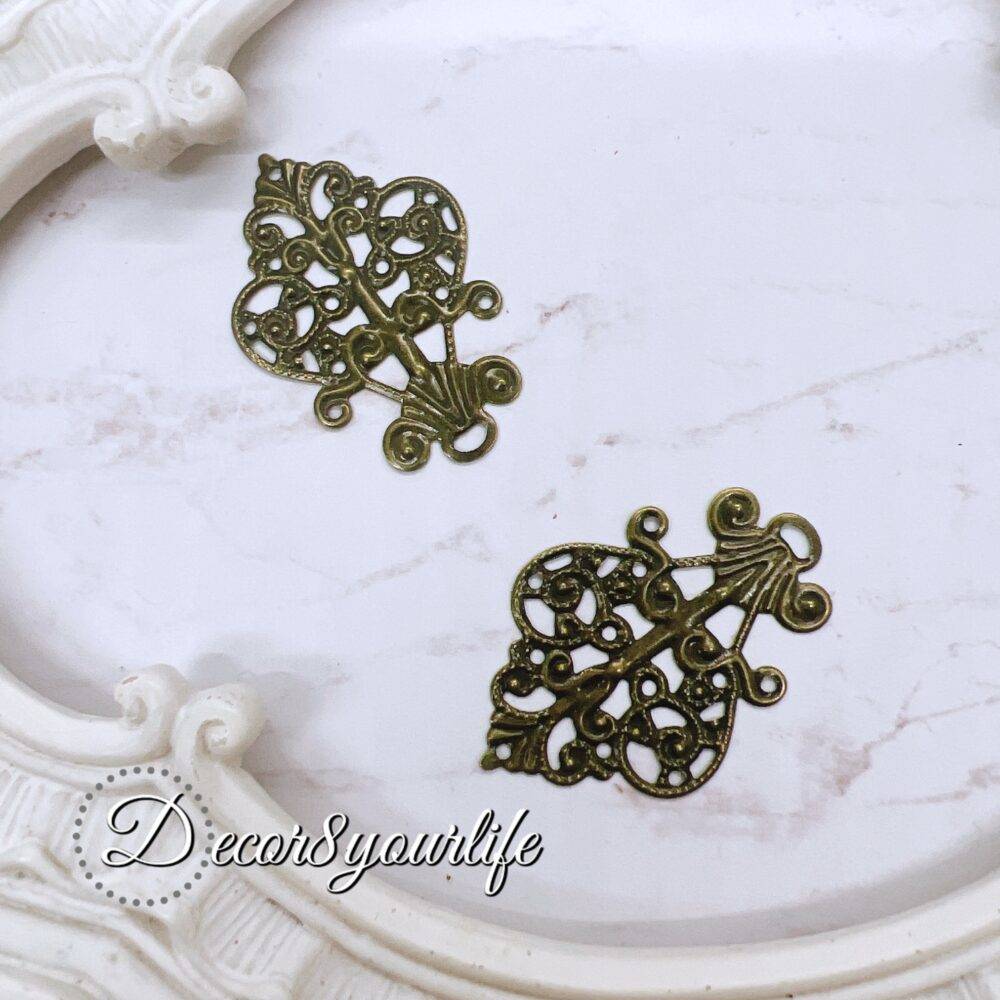 Antique filigree metal embellishment for crafts, pack of 2, intricate design for scrapbook and DIY decor.