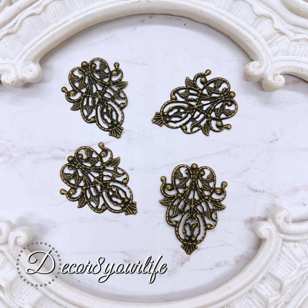 Antique filigree metal embellishment for crafts, pack of 2, intricate design for scrapbook and DIY decor.