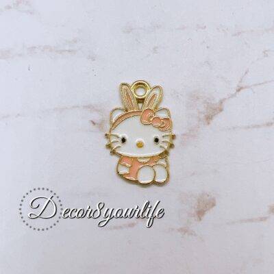 Licensed Sanrio Hello Kitty charm in gold and pastel pink with bunny ears, perfect for crafting and DIY.