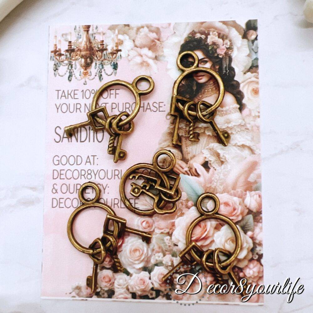 Metal key charms for crafts - vintage bronze embellishments perfect for scrapbooking, journals, mini albums, mixed media, and beadable pens. High-quality, antique-style key charms add rustic charm to DIY projects.