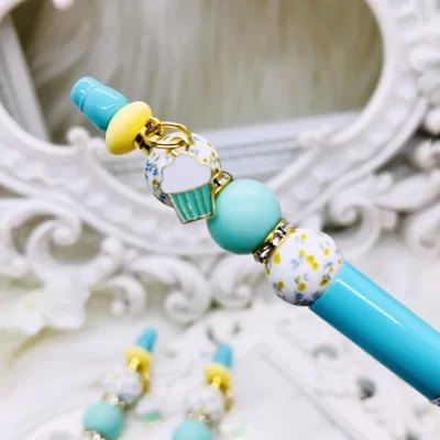 Tiffany blue beaded pen with cupcake charm