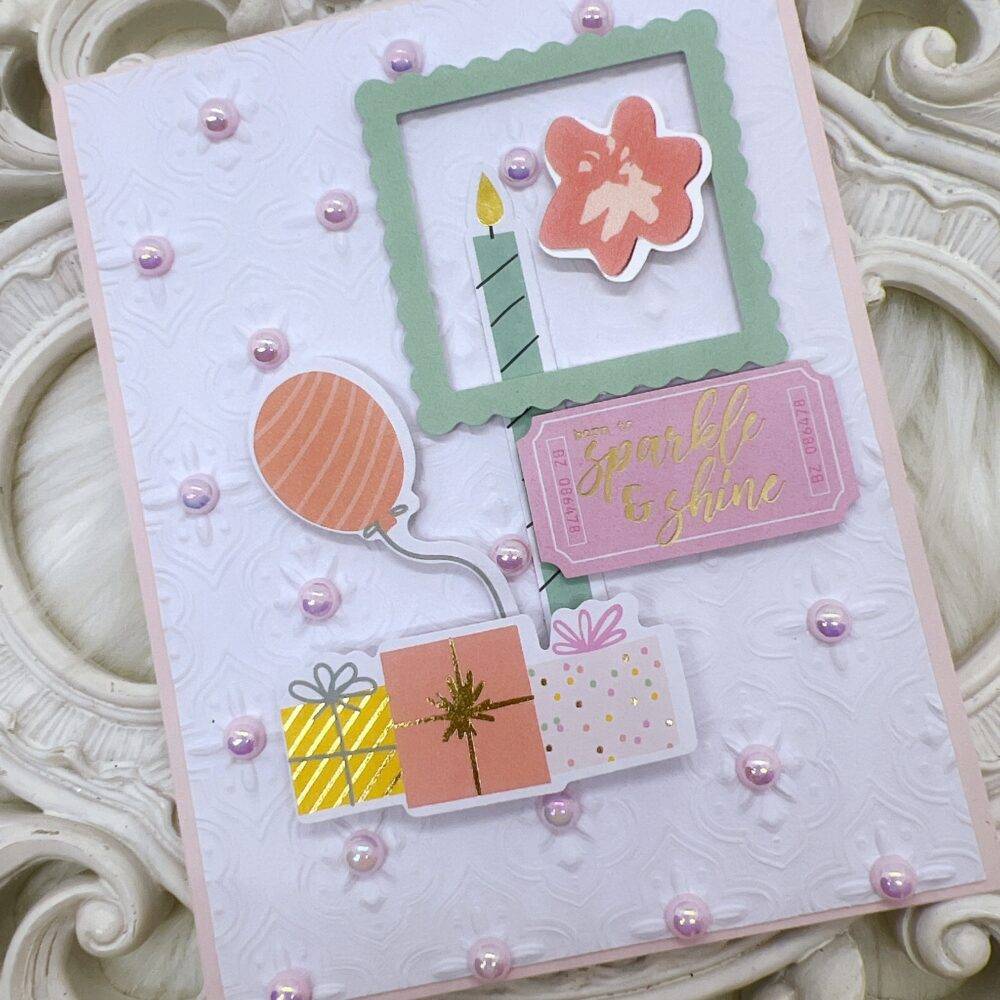 Handmade Greeting Card with Embossed Design and Die-Cut Embellishments.