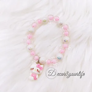 Hello Kitty beaded bracelet for girls, handmade with quality pink and white beads, Hello Kitty charm, and durable 0.5mm stretch cord, perfect for kids' accessories and gifts.