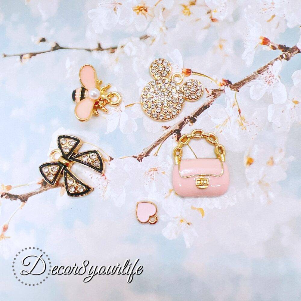 Explore our Elegant Pink and White Charm Grab Bags, each offering a unique assortment of high-quality charms perfect for DIY jewelry, scrapbooking, and more.