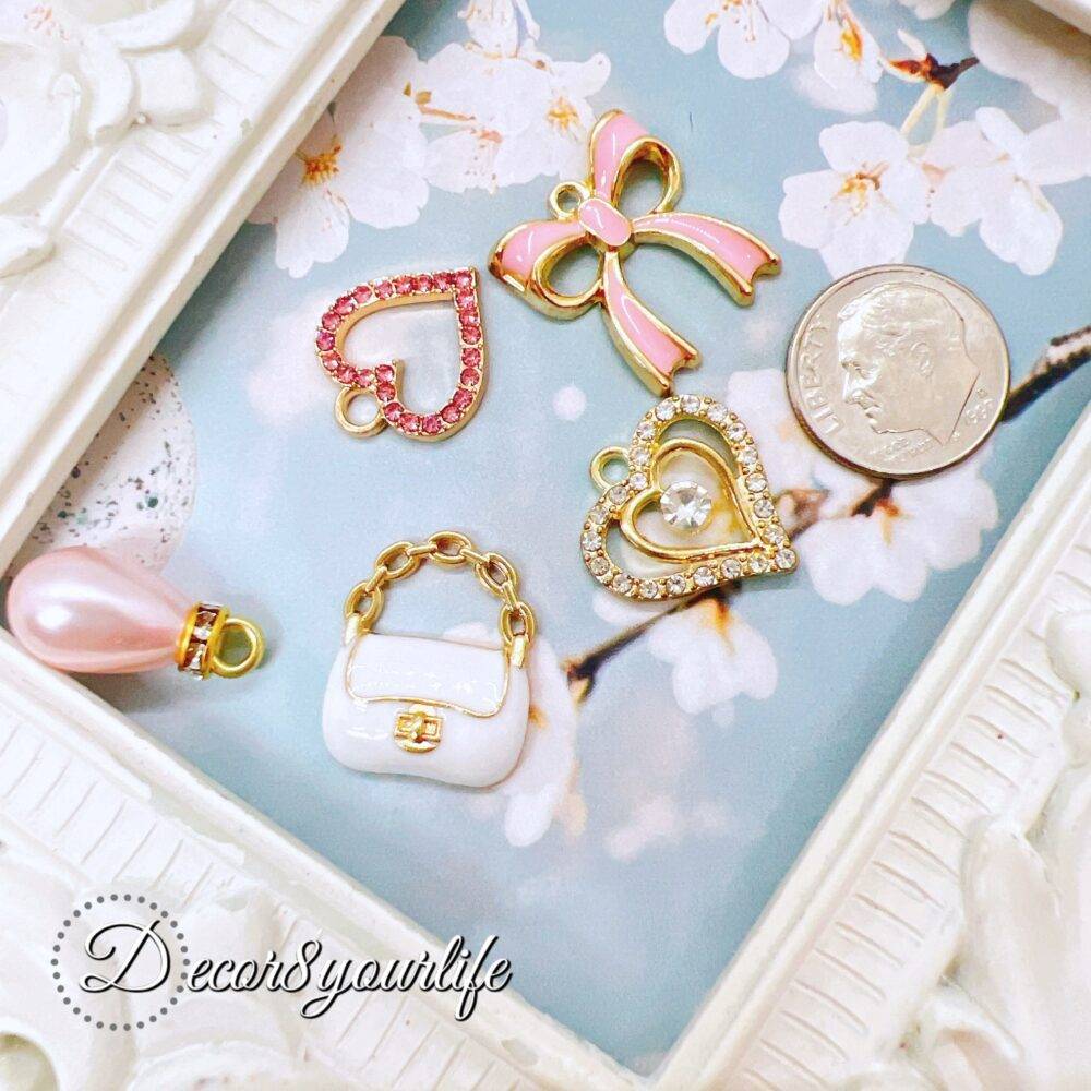 Explore our Elegant Pink and White Charm Grab Bags, each offering a unique assortment of high-quality charms perfect for DIY jewelry, scrapbooks, journals,beaded pens,planner accessories, and more.