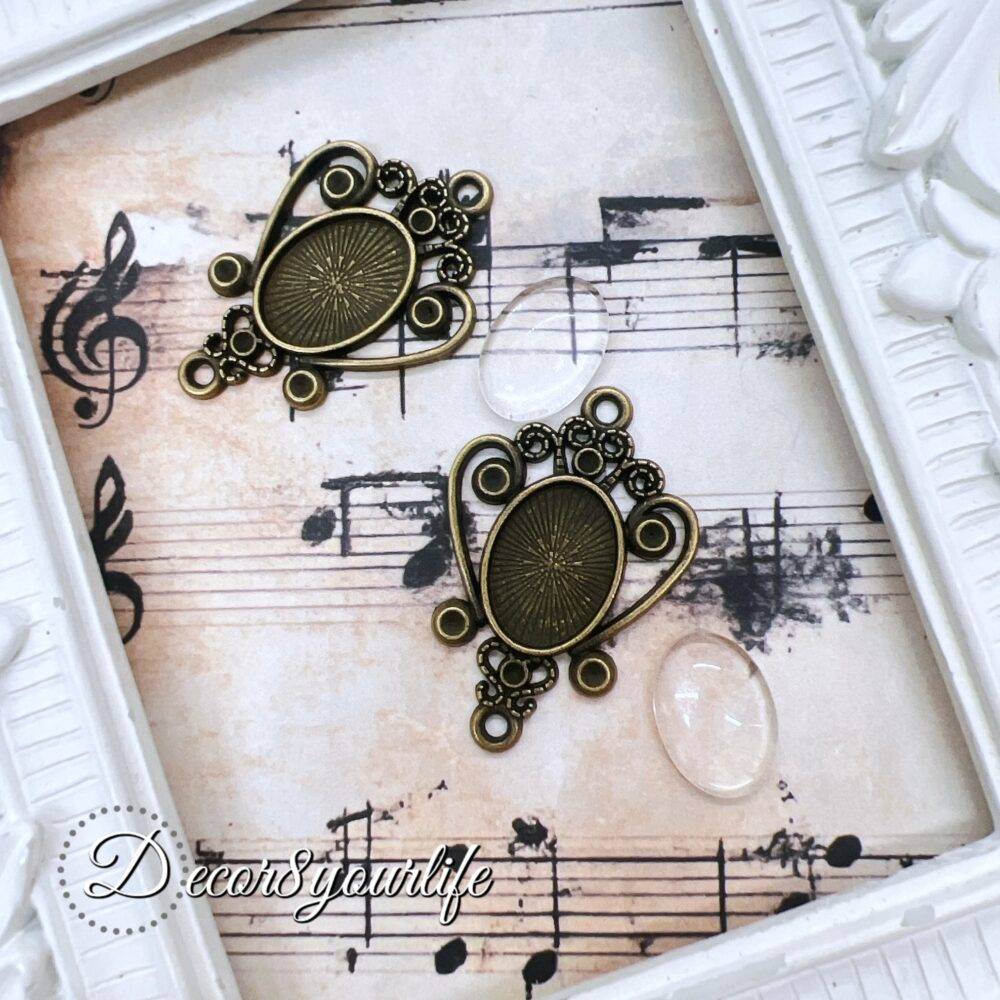 Vintage-style zinc-alloy cabochon settings pendants with an antique bronze finish, measuring approximately 1.25 x 1 inches. Perfect for DIY jewelry making, scrapbooking, and mini album charms.