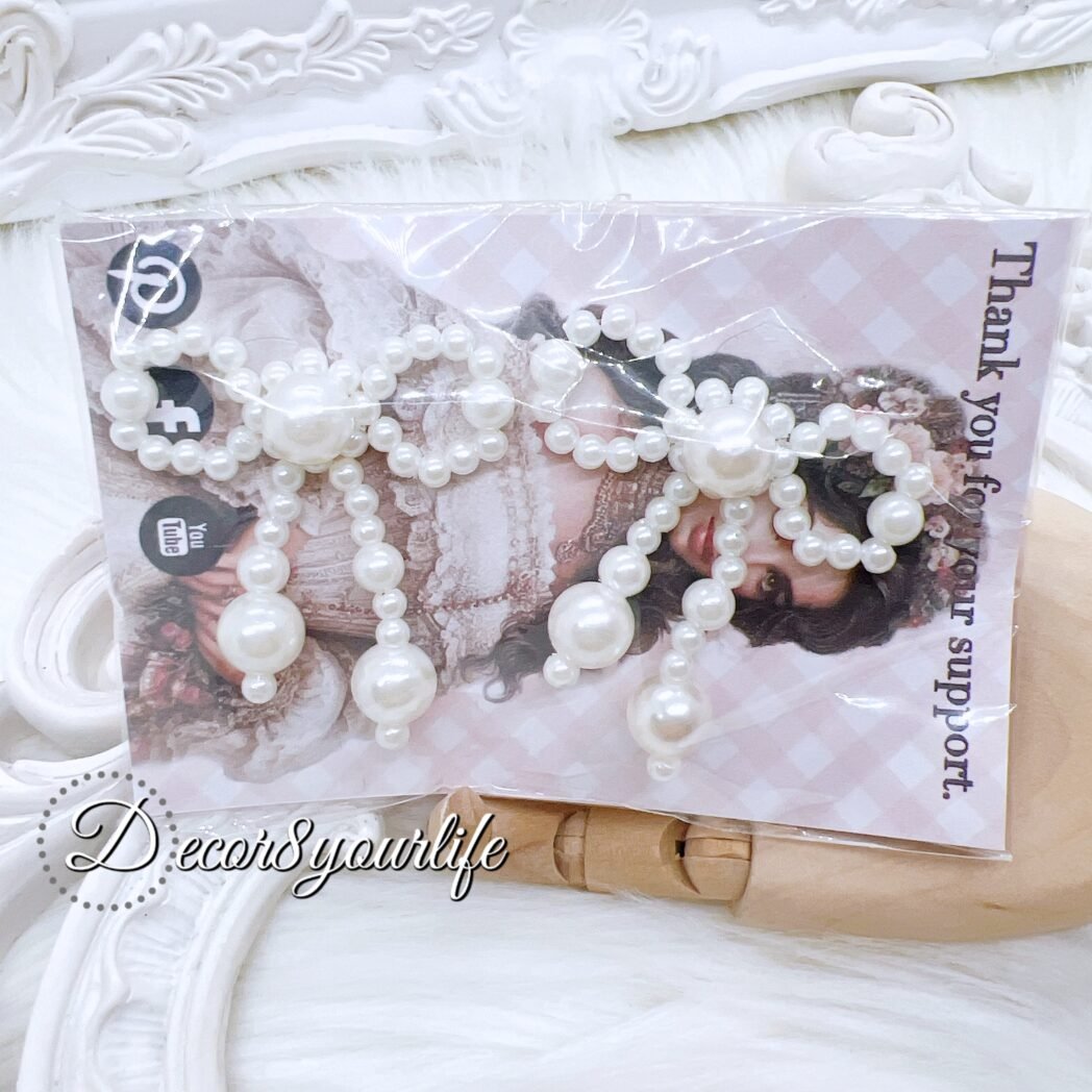 Handmade pearl beaded bows for diy craft projects like purse charms, key-chains, scrapbook embellishments, journal embellishments and home decor.