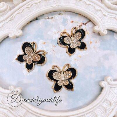 Set of three black flatback butterfly embellishments with gold trim and rhinestone details, ideal for scrapbooking, junk journals, card making, and DIY crafts