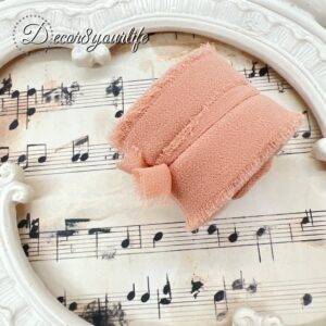 Roll of soft, sheer chiffon silk ribbon, 5 yards in length, perfect for crafting, DIY projects, and floral arrangements.