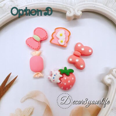 Kawaii pink cabochons.The set includes five small flat-back resin embellishments in coordinating pink shades. Each cabochon measures about 0.5 to 1 inch and can be glued onto planner dashboards, scrapbook covers, bows, resin keychains, shaker projects, and gift tags.