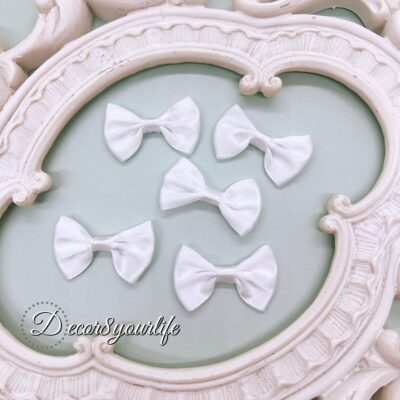 Handmade satin bows in assorted colors for crafting and DIY projects