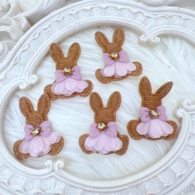 Fabric bunny appliques with mesh skirt and lavender bow featuring rhinestone center. Craft Supplies decor8yourlife store.