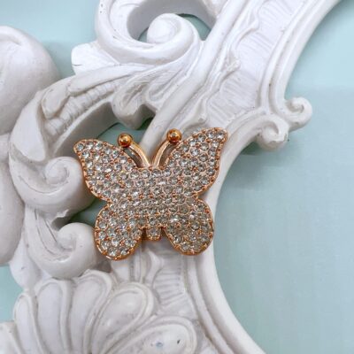 Rose gold rhinestone butterfly cabochons with clear crystals on a flatback resin base for scrapbook and journal embellishments