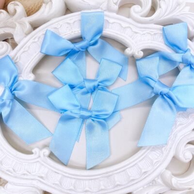 Set of three Handmade Satin Bows in Pastel Blue color.