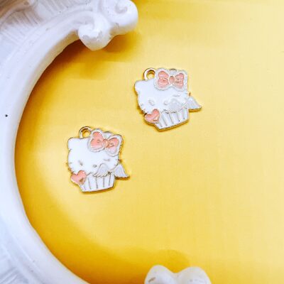 Hello Kitty enamel charm for jewelry making and craft projects, officially licensed Sanrio character charm used for beaded pens, keychains, bracelets, scrapbooking, planner accessories, and kawaii DIY embellishments