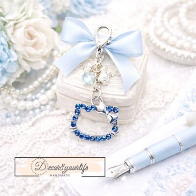 Official Sanrio licensed blue and white Hello Kitty enamel and rhinestone charm set in silver tone, pack of six small kawaii craft charms for planners, jewelry making and scrapbooking