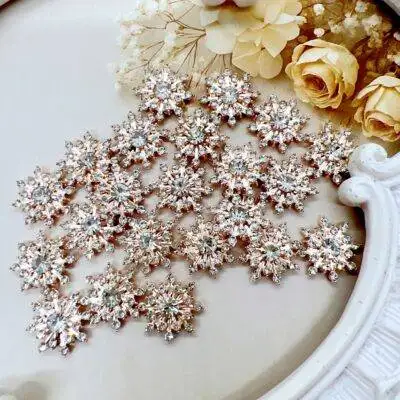 Gold alloy snowflake cabochon embellishment for crafts. Level up your craft projects with craft supplies from Decor8yourlife. Use these metal embellishments on diy crafts like wedding invitations, scrapbooks, journals and more.