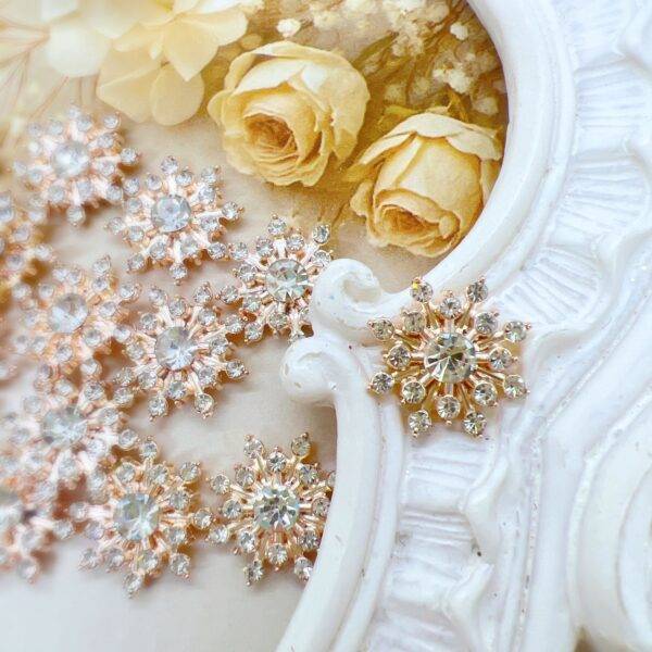 Gold alloy snowflake cabochon embellishment for crafts. Level up your craft projects with craft supplies from Decor8yourlife. Use these metal embellishments on diy crafts like wedding invitations, scrapbooks, journals and more.