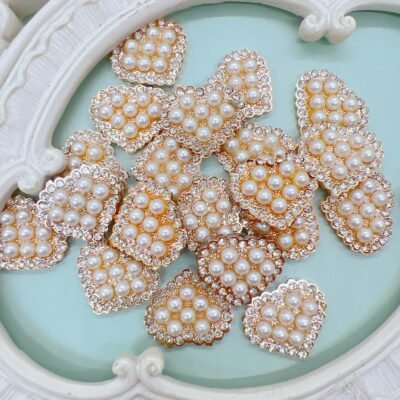 Hear shaped cabochons with white pearls and rhinestone edge trim. These cabochons may be used as craft embellishments or wedding DIY crafts like mini album,scrapbooks,journals,card making,wedding decor and much more.