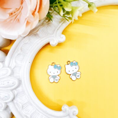 Hello Kitty licensed Sanrio charms. These charms may be used for making earrings, jewelry, purse charms, planner charms, journal charms and other DIY craft projects. Two charms per pack.
