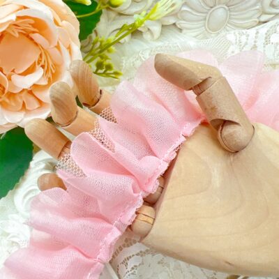 Vintage style, shabby chic craft trim for junk journals and planners in pink color, approximately 2 yards, used for layering and embellishing handmade crafts and sewing projects.