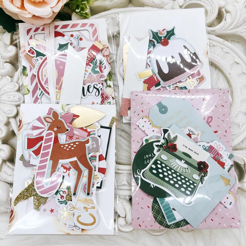 Christmas-themed ephemera pack with 30 festive die-cut paper elements, including ornaments, candy canes, wreaths, and holiday tags