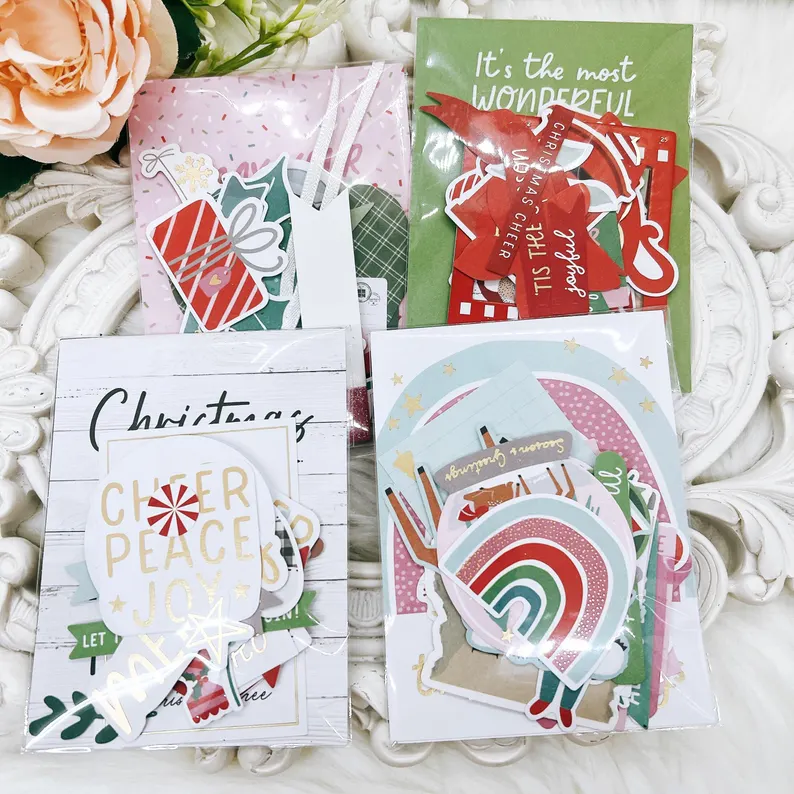 Christmas-themed ephemera pack with 30 festive die-cut paper elements, including ornaments, candy canes, wreaths, and holiday tags