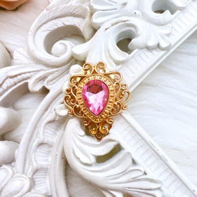 Faux pink sapphire teardrop embellishment for crafts. Use in shabby chic, cottage-core craft projects and bridal makes. Craft supplies online store Decor8yourlife.