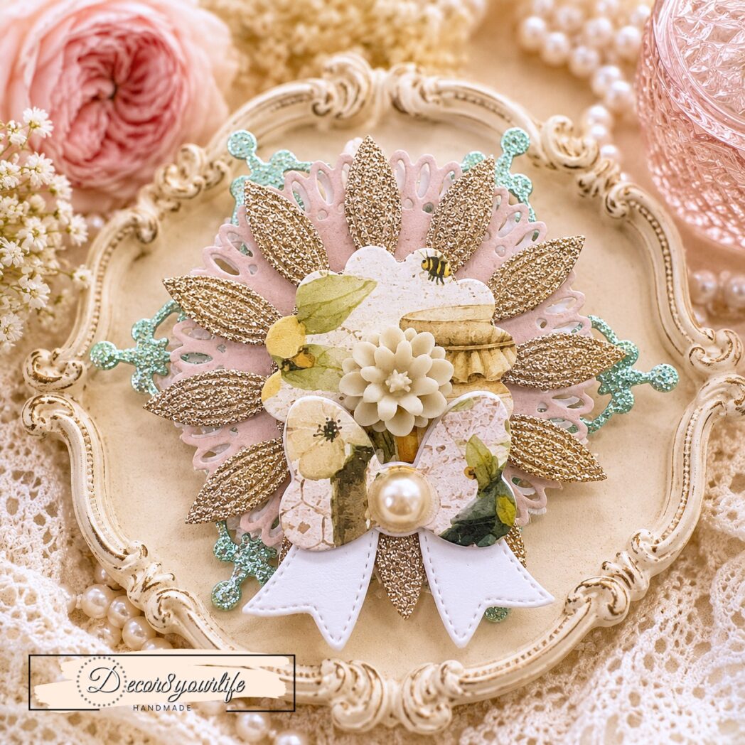Handmade layered paper rosette embellishment created with circle dies, decorative frame dies, glitter cardstock, watercolor paper, and papers from the Honey Bees & Summer Breeze scrapbook collection by Decor8yourlife.