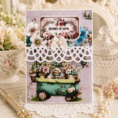 Handmade boutique writing pad featuring vintage floral artwork, whimsical bee illustrations, layered embellishments, satin bow, pearl accent, and decorative lace border from the Decor8yourlife Nestled in Spring Collection.