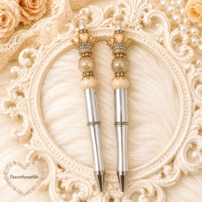 Luxury silver handmade beaded pens with champagne pearl beads, crystal crown toppers, and elegant writing accessories by Decor8yourlife displayed on a romantic vintage background.