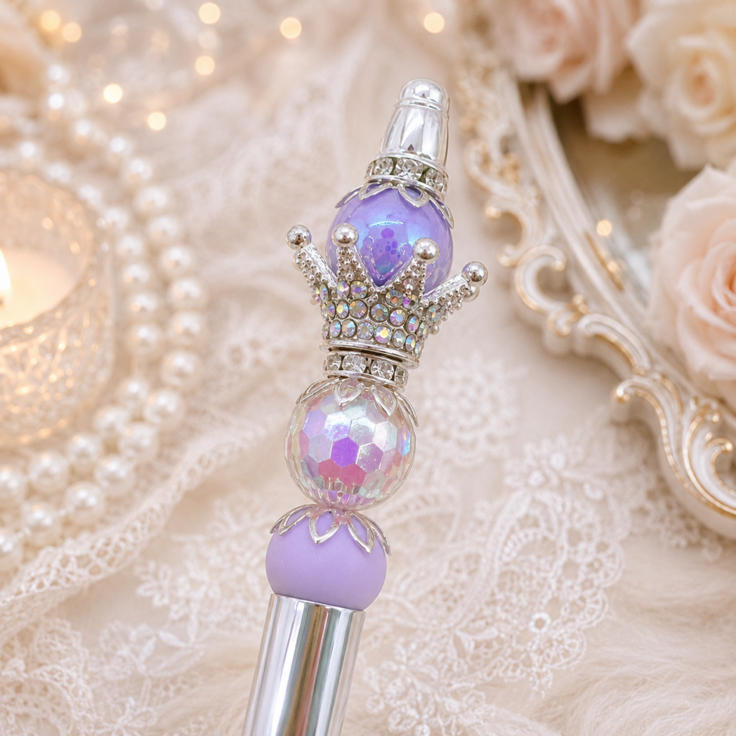 Close-up of a handmade lavender luxury beaded pen featuring PandaHall beadable pen components, silver crown topper, iridescent crystal bead, and soft purple accents.