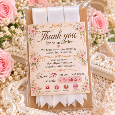 Ten white satin bow-making strips with precut pointed ends arranged in a clear package on kraft backing.